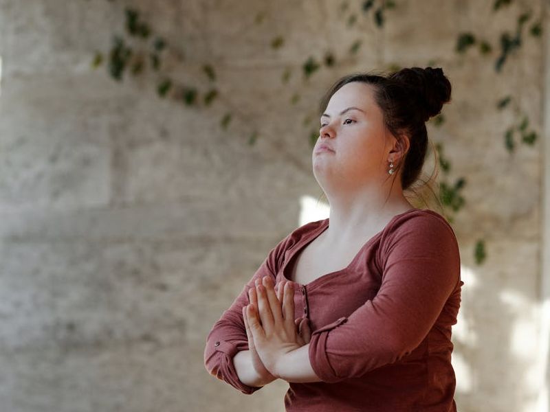 Main image showing a person in a serene, balanced yoga pose.